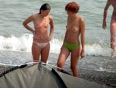 2 topless girls on public beach