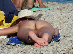 Behind her butt at a beach