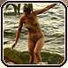 Spy shot of a nude babe leaving water